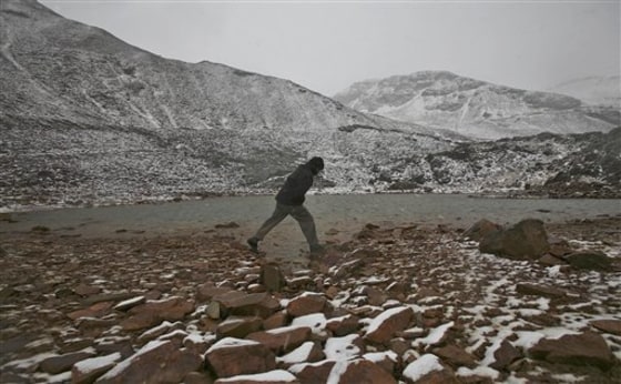 FILE - In this Saturday, Oct. 24, 2009 file photo a man walks on Glacier Chacaltaya in the Andes mountains in Bolivia. The U.N. science body on climate change, accused of ignoring its critics and allowing glaring errors to creep into its work, announced Wednesday June 23, 2010, that a broader range of experts will write its next report on global warming. The Intergovernmental Panel on Climate Change included more women and scientists from developing countries, but also selected authors with a wider range of backgrounds than previously _ partly in response to recent criticism that earlier groups refused to address dissenting views. \"We didn't want old club members who repeat themselves from one assessment to the next,\" Jean-Pascal van Ypersele, the group's vice premier, told The Associated Press on Wednesday. (AP Photo/Juan Karita, File)